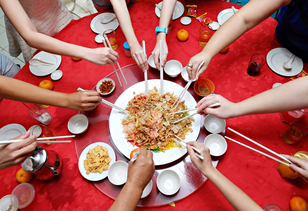 Traditional Yee Sang toss for wealth and prosperity