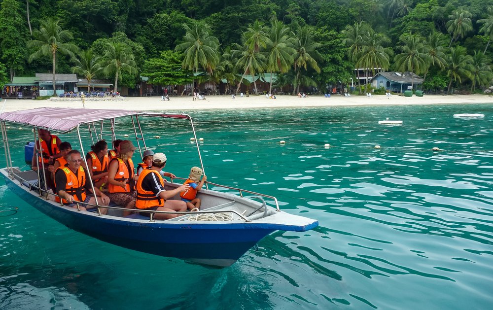 Boat man taking people snorkelling at tioman