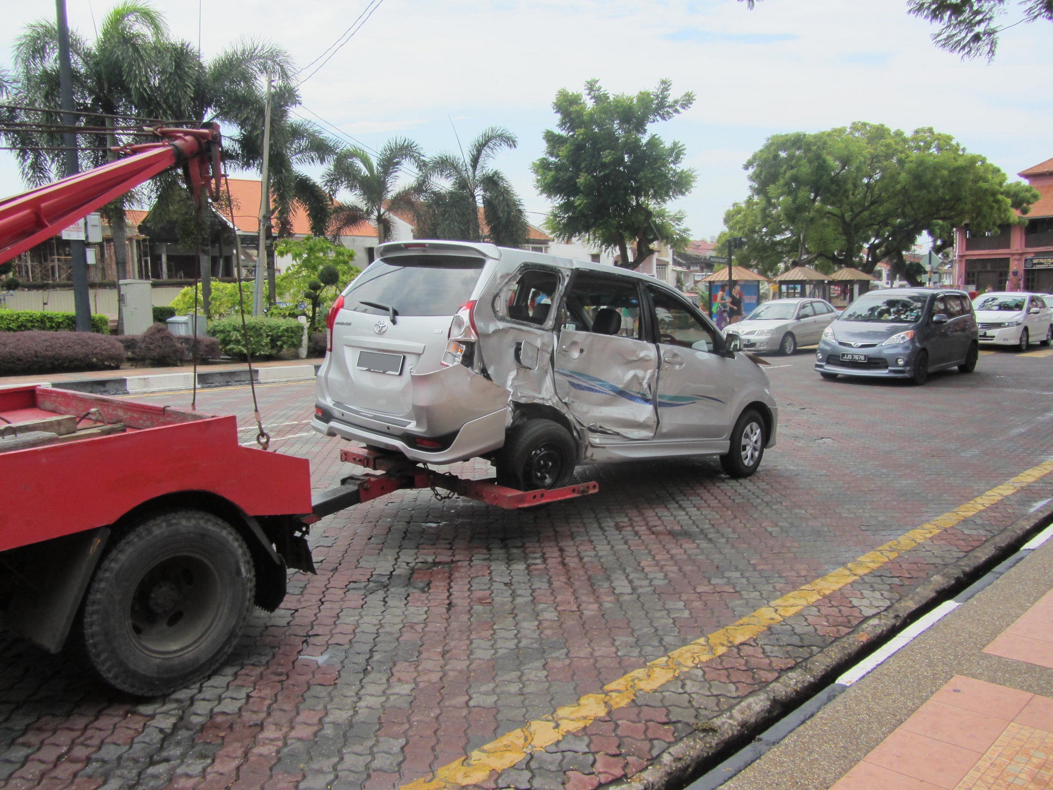 Car being towed | Photo credit: Jason Thien