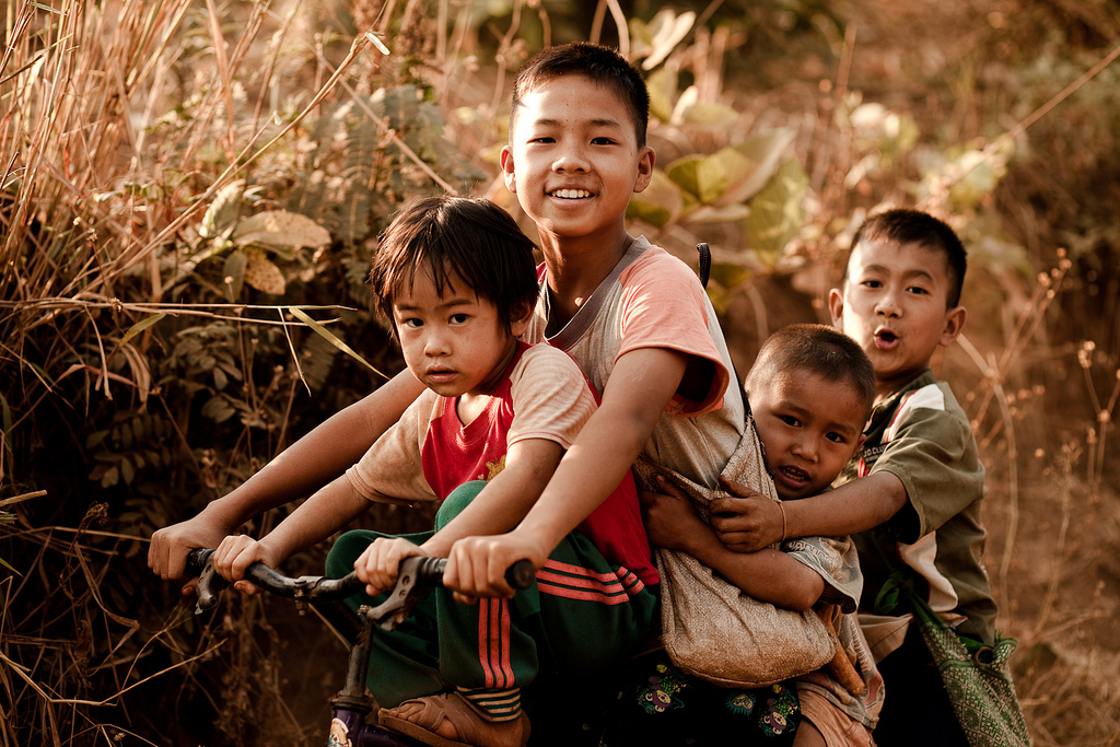 Thai boys on a bike | Photo credit: Eric Montfort