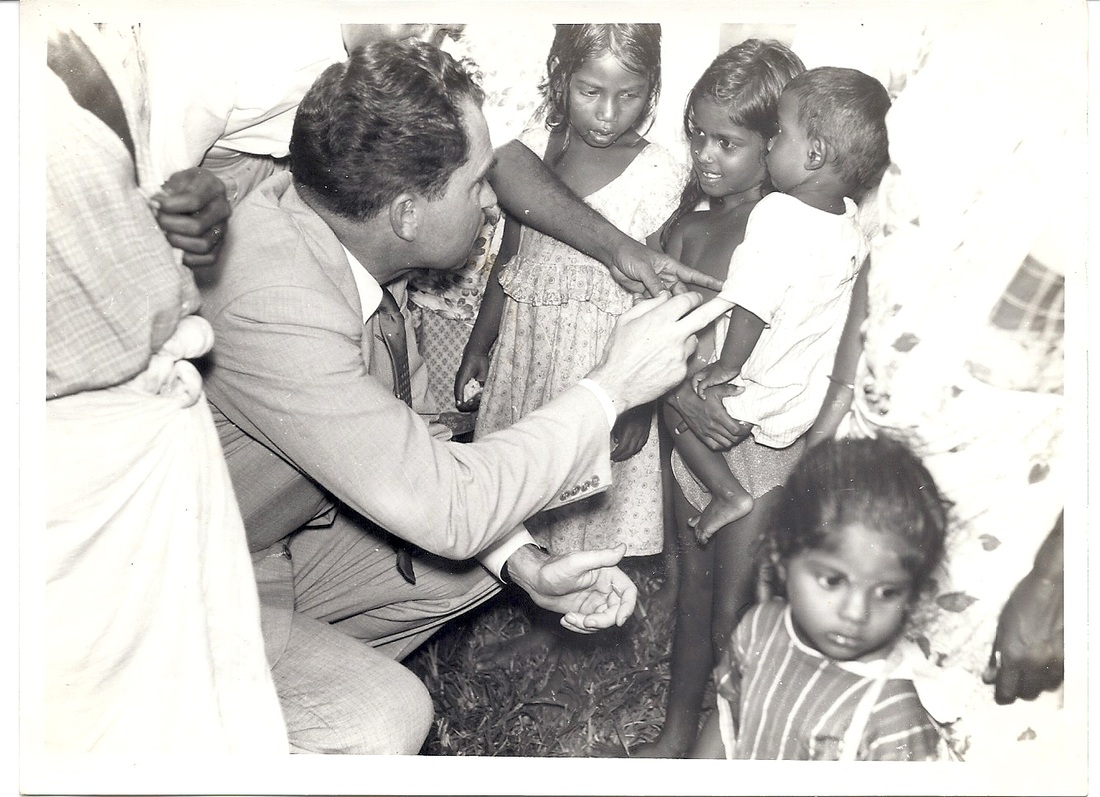 16. Playing with children at rubber estate
