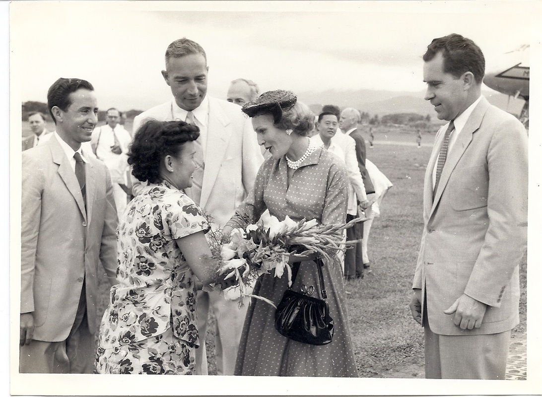 5. Miss Loh presents flowers to Mrs. Nixon.